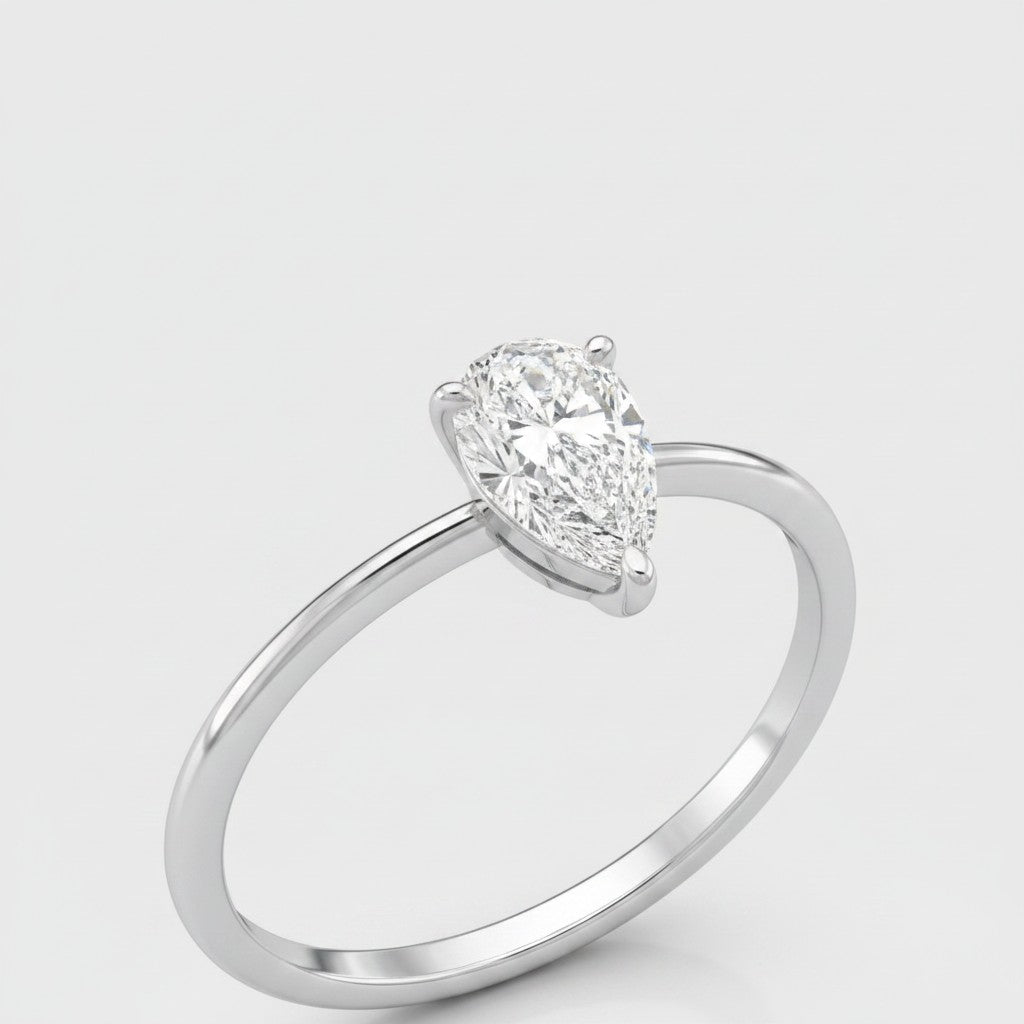 Cassims&Co. 9ct white gold engagement ring featuring a 0.50ct pear-shaped lab grown diamond in a four-claw setting.