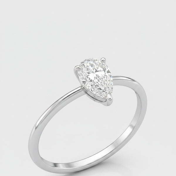 Cassims&Co. 9ct white gold engagement ring featuring a 0.50ct pear-shaped lab grown diamond in a four-claw setting.