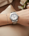 Cassims&Co. TAG Heuer Aquaracer ladies watch with mother-of-pearl dial and stainless steel bracelet on a wrist.