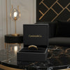 Cassims&Co. 9ct yellow gold eternity ring with lab grown diamonds displayed in a black branded jewellery box.