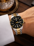 Two-tone stainless steel case and unidirectional rotating bezel on TAG Heuer Formula 1 quartz watch