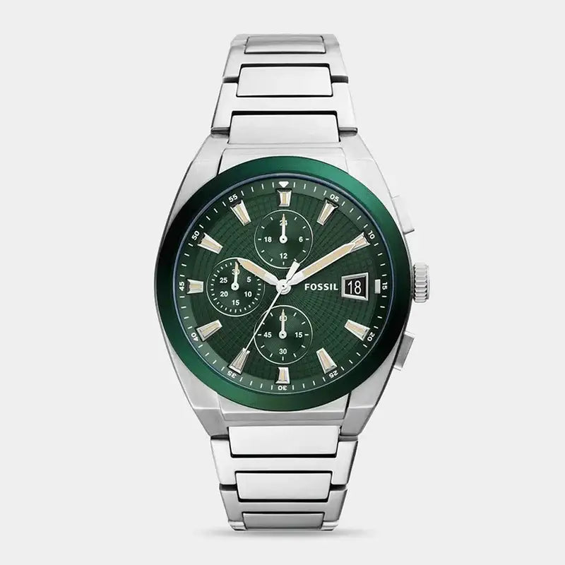 Fossil Everett FS5964 chronograph watch with green textured dial, green aluminium bezel, and stainless steel integrated bracelet on white background