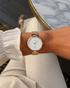 Front view of 32mm gold-tone case with single diamond marker at 12 o'clock