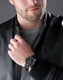 Round 43mm stainless steel case with black tachymeter bezel on leather strap