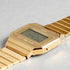 Adjustable fold-over clasp closed on the gold-tone steel bracelet