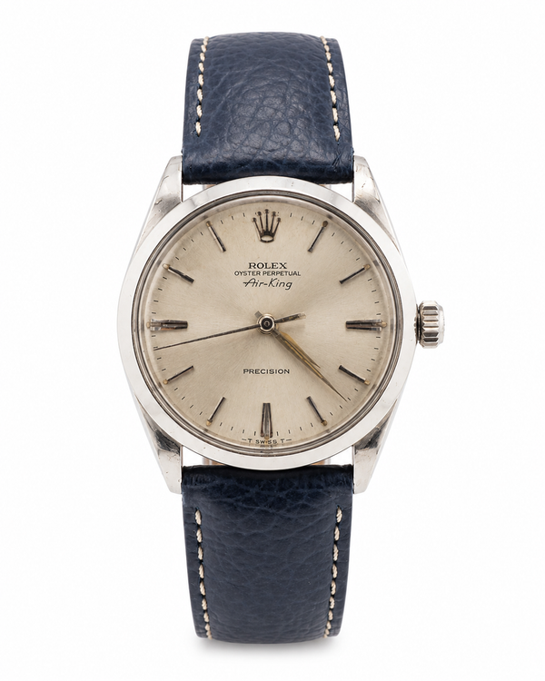 Vintage Rolex Oyster Perpetual Air-King Precision automatic watch with silver sunburst dial, stainless steel case, and blue leather strap—pre-owned at Cassim & Co. Johannesburg