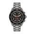 Michael Kors Maritime MK9204 gunmetal chronograph diver watch with black dial, rose gold accents, and stainless steel bracelet on white background