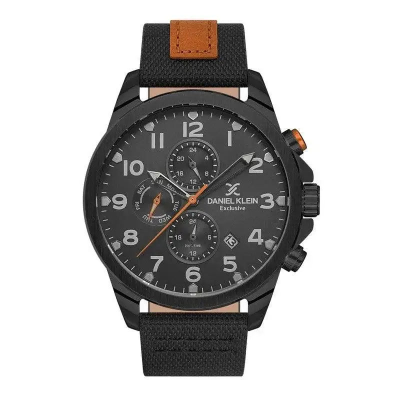 Daniel Klein Exclusive DK.1.13538-6 mens chronograph watch with 45mm black ion-plated case, matte black dial with orange accents, Arabic numerals, three sub-dials, and black textile strap with tan leather detailing
