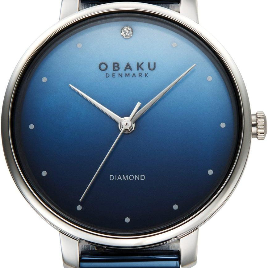 Obaku Denmark V320LXCZML ladies quartz watch with blue gradient sunburst dial, diamond accent at 12 o'clock, and blue PVD stainless steel mesh bracelet