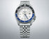 Three-fold clasp with push button release on steel bracelet