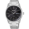 Seiko SNE527P1 solar-powered watch with black sunburst dial, stainless steel case and bracelet, sapphire crystal, and day-date display