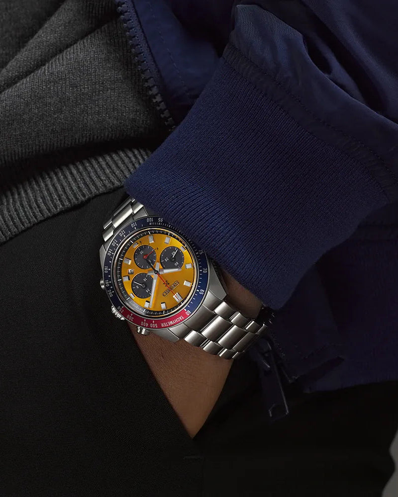Yellow dial with black sub-dials, date window at 4 o'clock and luminous hands