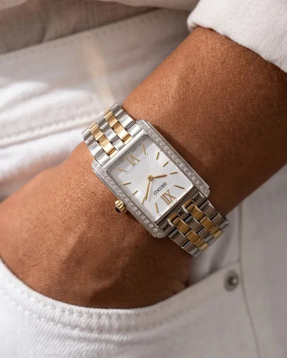 Seiko SWR093P1 two-tone stainless steel bracelet laid flat