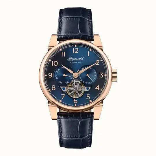 Ingersoll The Swing I12702 automatic watch with open heart blue dial, rose gold stainless steel case, and navy blue leather strap