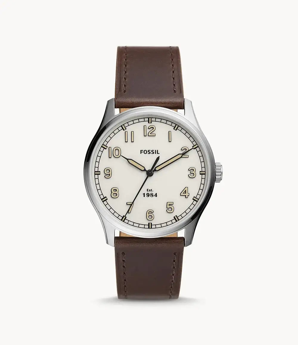 Fossil Dayliner FS5927 quartz watch with cream dial, stainless steel case, and brown leather strap on white background
