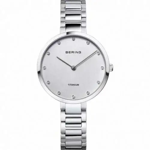 Bering 11334-770 titanium ladies watch with silver sunray dial, diamond hour markers, and polished titanium bracelet on white background